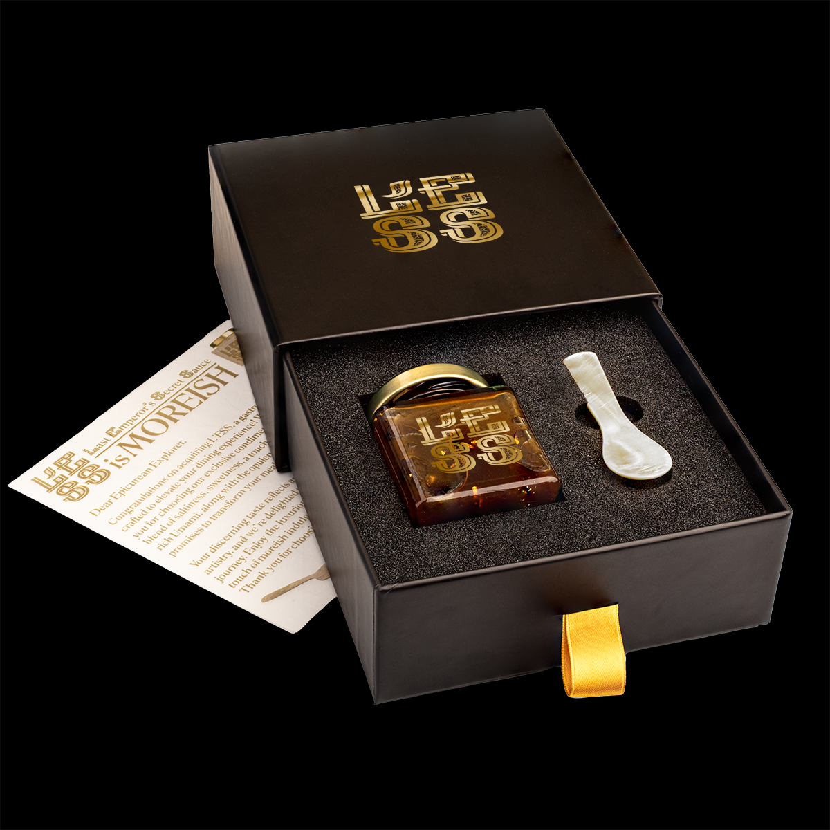 A luxurious gift box featuring a jar of L'ESS and a mother of pearl spoon, exuding opulence and elegance, perfect for gourmet indulgence or gifting.