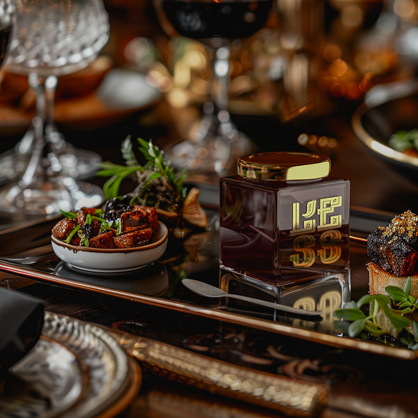 L'ESS Gourmet Condiment Enhancing an Elegant Dining Experience on a Lavishly Set Table – Culinary Luxury and Sophistication.